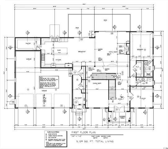 a black and white photo of a living room