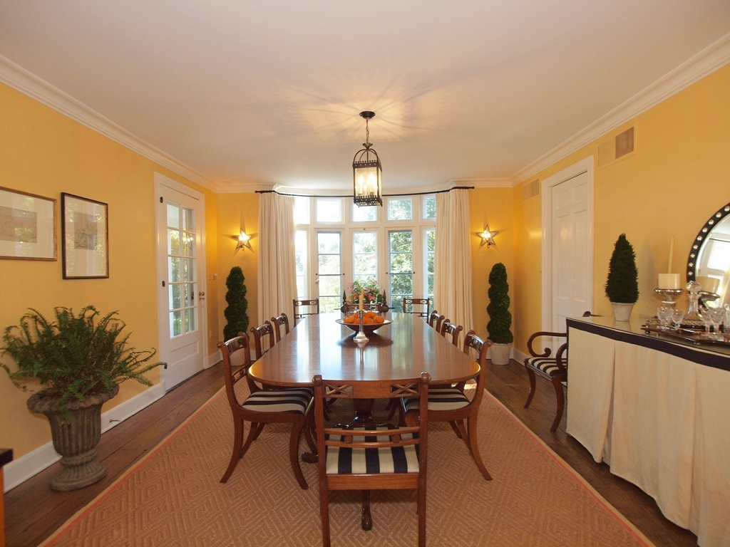 230 Rosebrook Road New Canaan, CT 06840 - Photo 11 of 25 a view of a dining room with furniture and chandelier