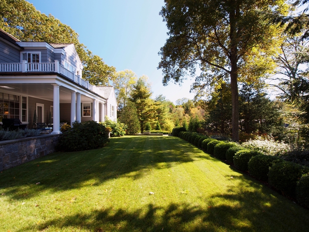 230 Rosebrook Road New Canaan, CT 06840 - Photo 2 of 25 a view of a house with pool and garden