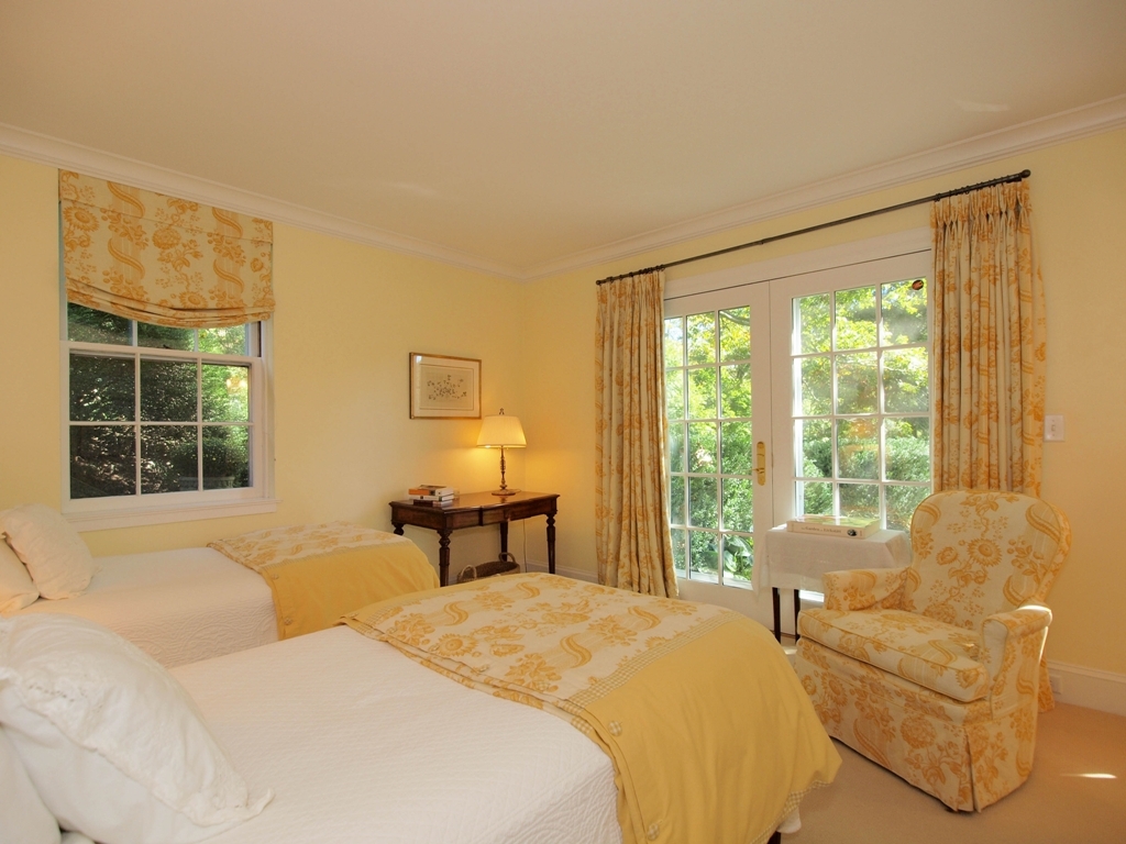 230 Rosebrook Road New Canaan, CT 06840 - Photo 22 of 25 a bedroom with a bed and a large window