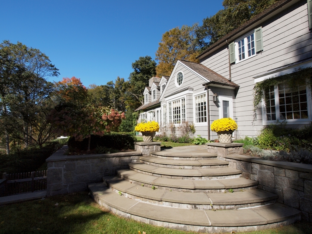 230 Rosebrook Road New Canaan, CT 06840 - Photo 4 of 25 a view of the house with a yard