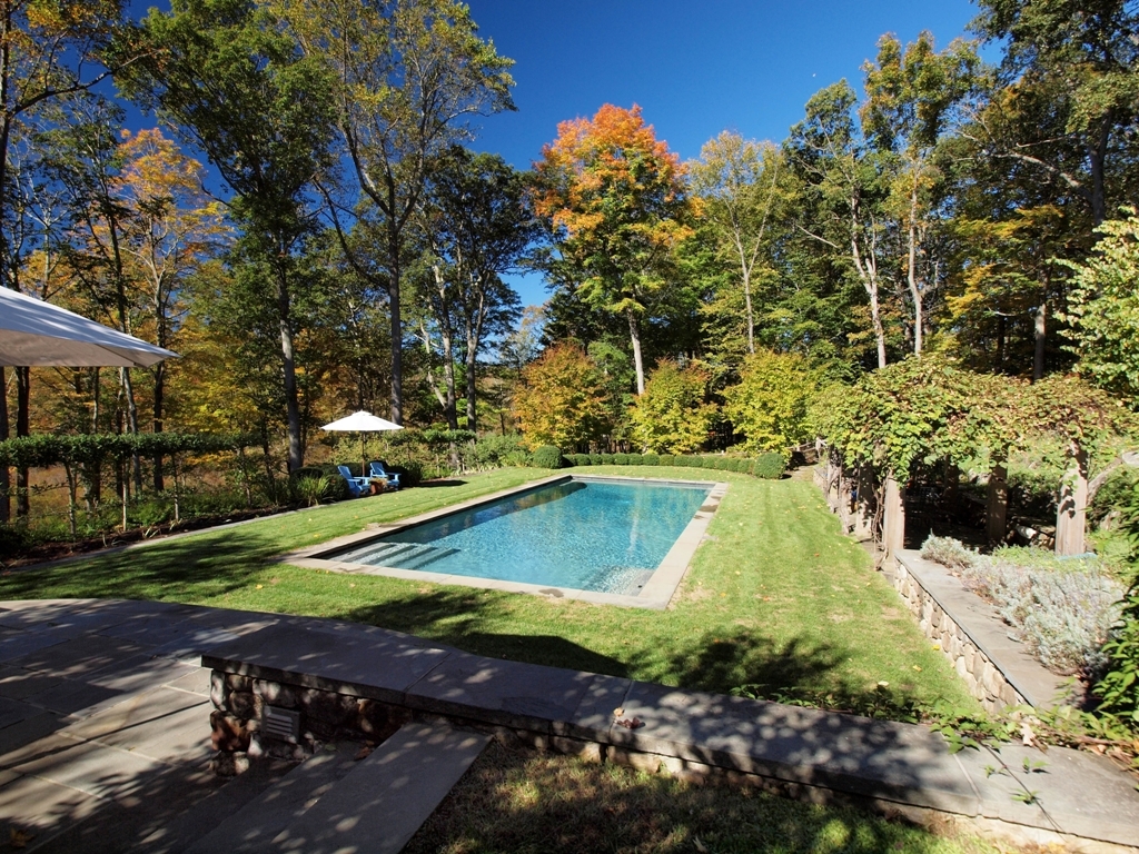230 Rosebrook Road New Canaan, CT 06840 - Photo 6 of 25 a view of a yard with plants