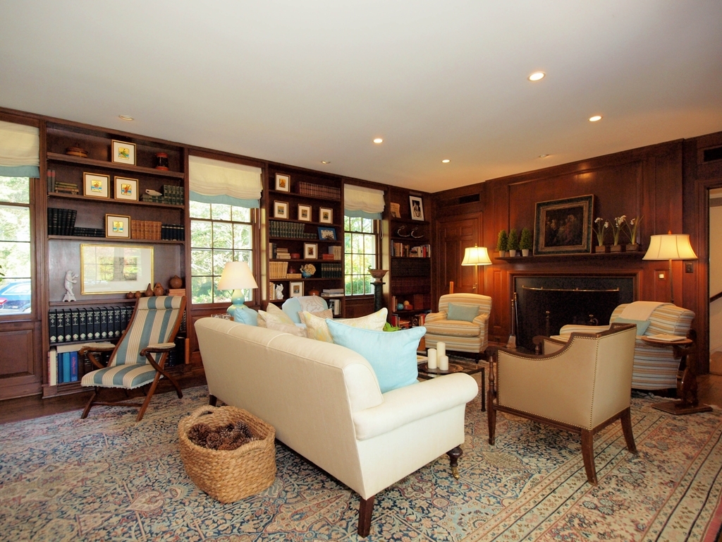 230 Rosebrook Road New Canaan, CT 06840 - Photo 10 of 25 a living room with furniture and a fireplace