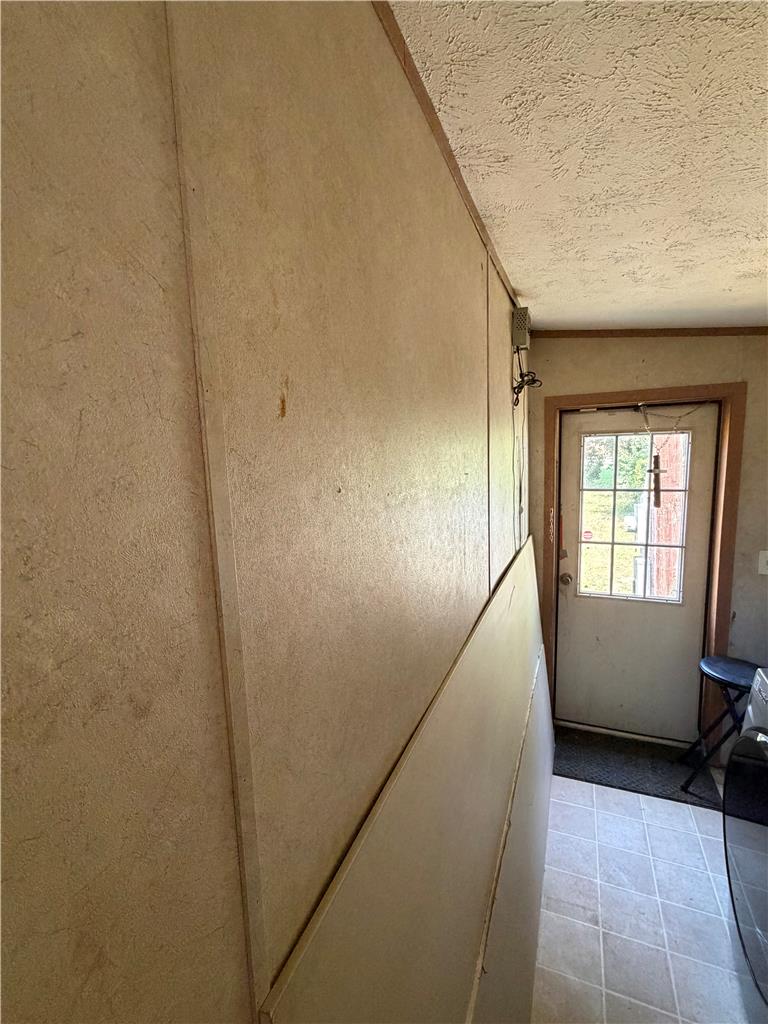 4541 Main Street Slatington, PA 18080 - Photo 25 of 27 A utilitarian entryway with practical tile flooring and a straightforward door leading to the outdoors.