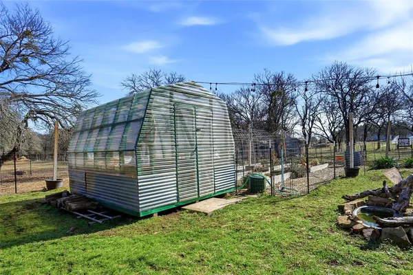 a view of a backyard with sitting area