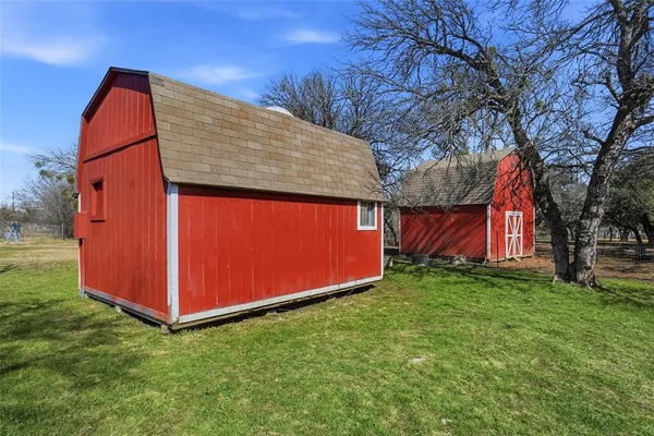 a view of backyard of house and outdoor space