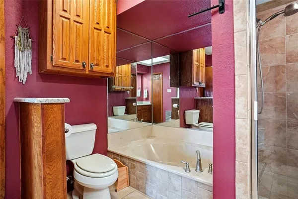 a bathroom with a sink and toilet