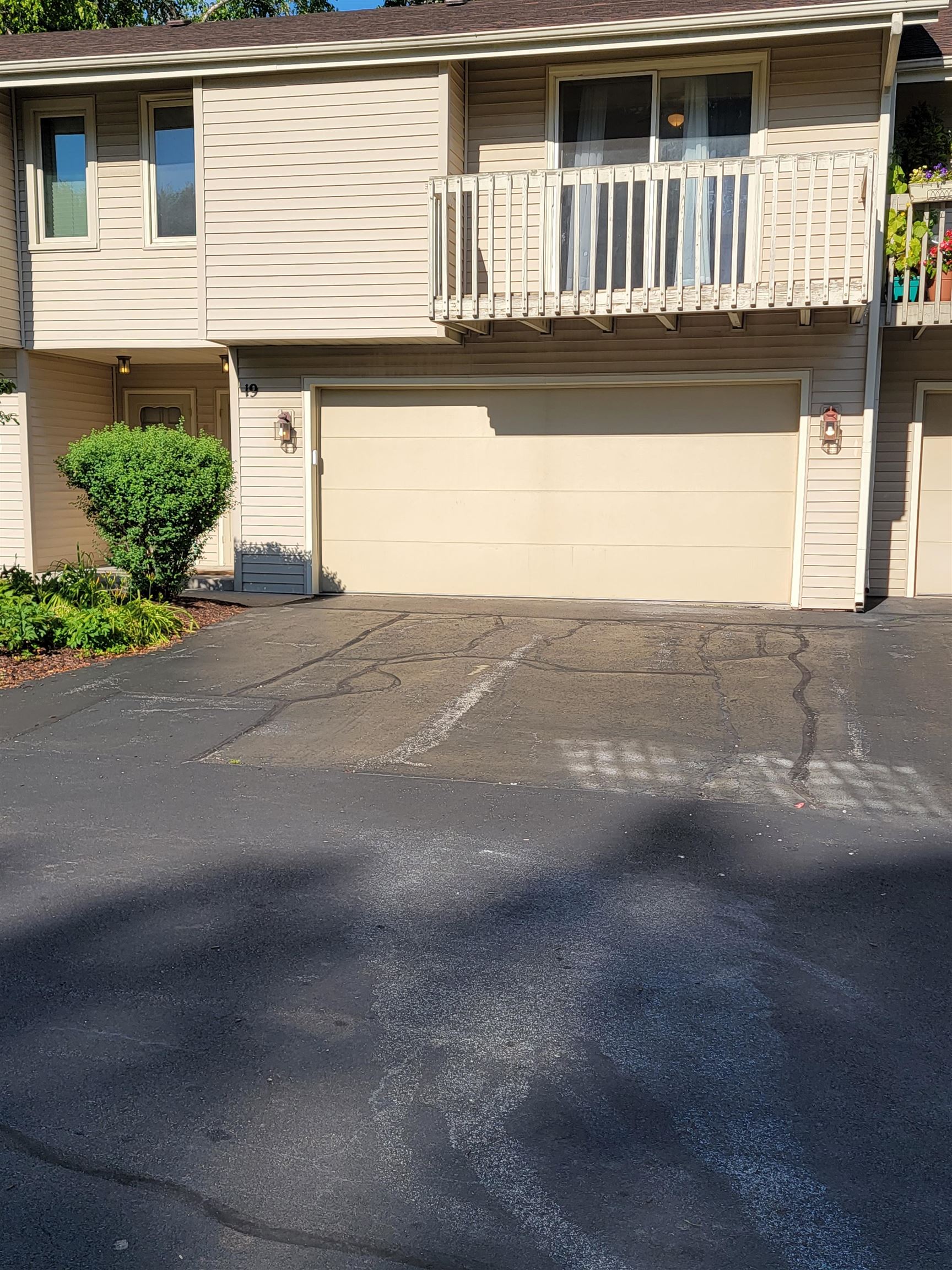 a front view of a house with garage