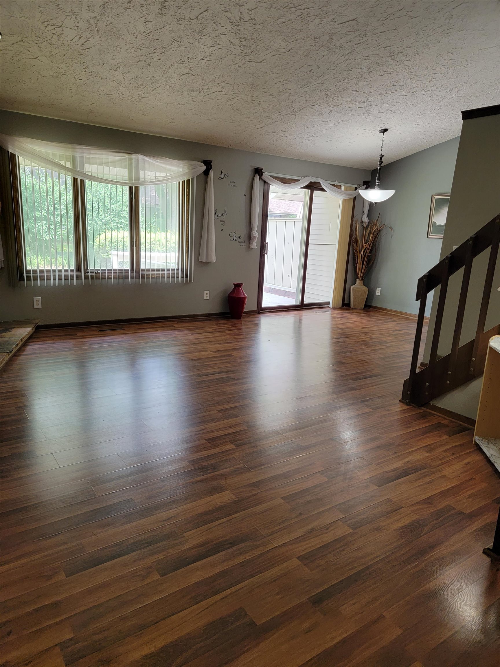4685 High Point Drive Rockford, IL 61114 - Photo 3 of 20 an empty room with wooden floor and windows