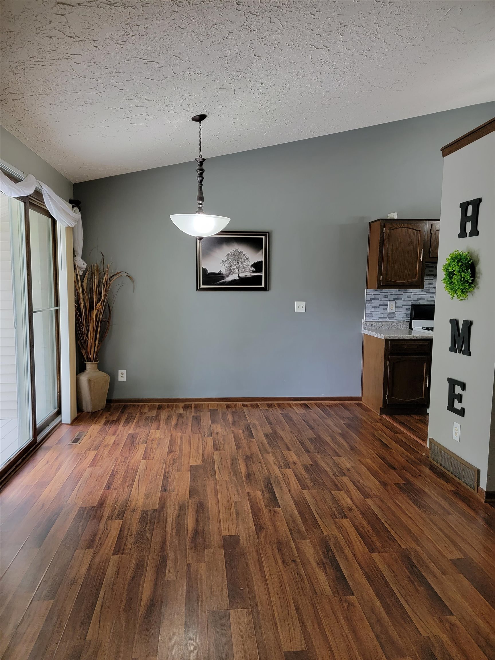 4685 High Point Drive Rockford, IL 61114 - Photo 4 of 20 a view of livingroom with hardwood floor and a ceiling fan