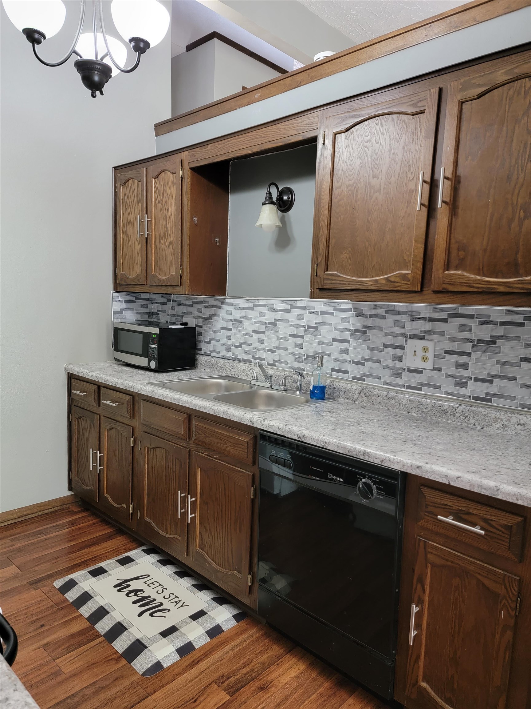 4685 High Point Drive Rockford, IL 61114 - Photo 7 of 20 a kitchen with stainless steel appliances granite countertop a sink stove and cabinets