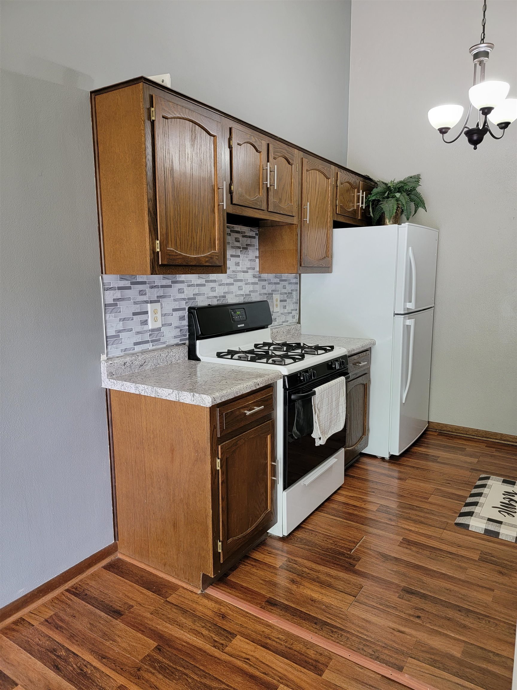 4685 High Point Drive Rockford, IL 61114 - Photo 8 of 20 a kitchen with stainless steel appliances granite countertop a stove a sink and a refrigerator