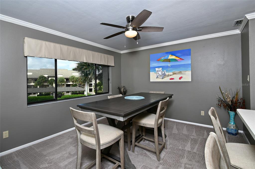 1590 Islamorada Boulevard, Unit 84C Punta Gorda, FL 33955 - Photo 16 of 38 a view of a dining room with furniture window and outside view