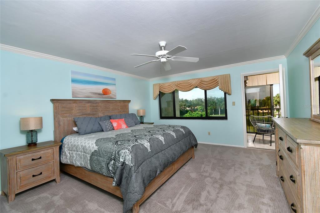 1590 Islamorada Boulevard, Unit 84C Punta Gorda, FL 33955 - Photo 22 of 38 a bedroom with a bed and a large window with outer view