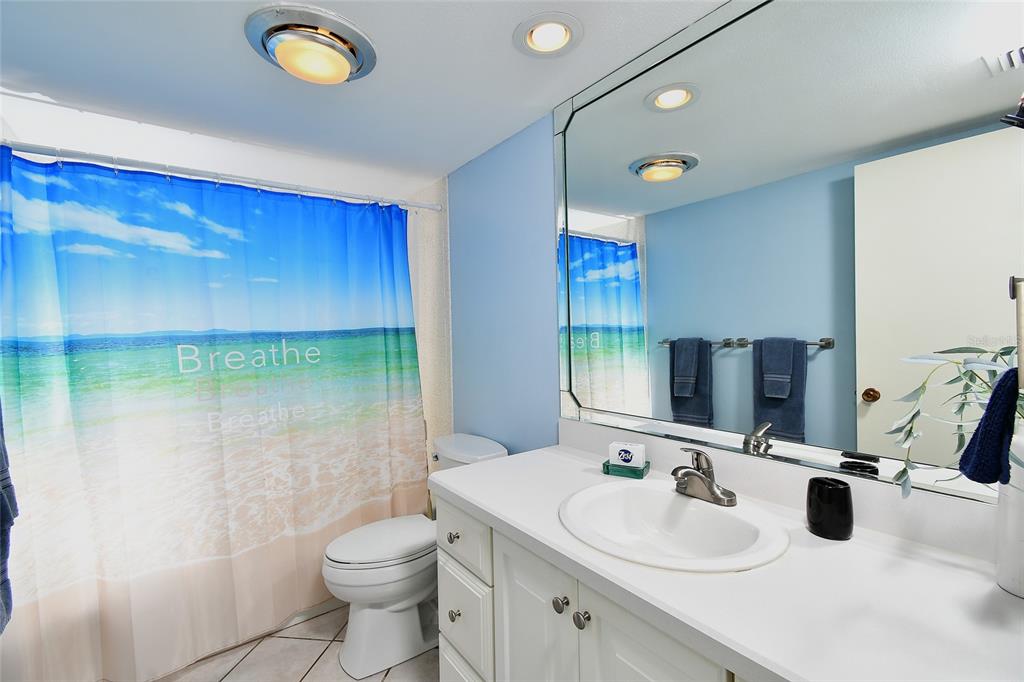 1590 Islamorada Boulevard, Unit 84C Punta Gorda, FL 33955 - Photo 29 of 38 a bathroom with a sink a toilet and shower