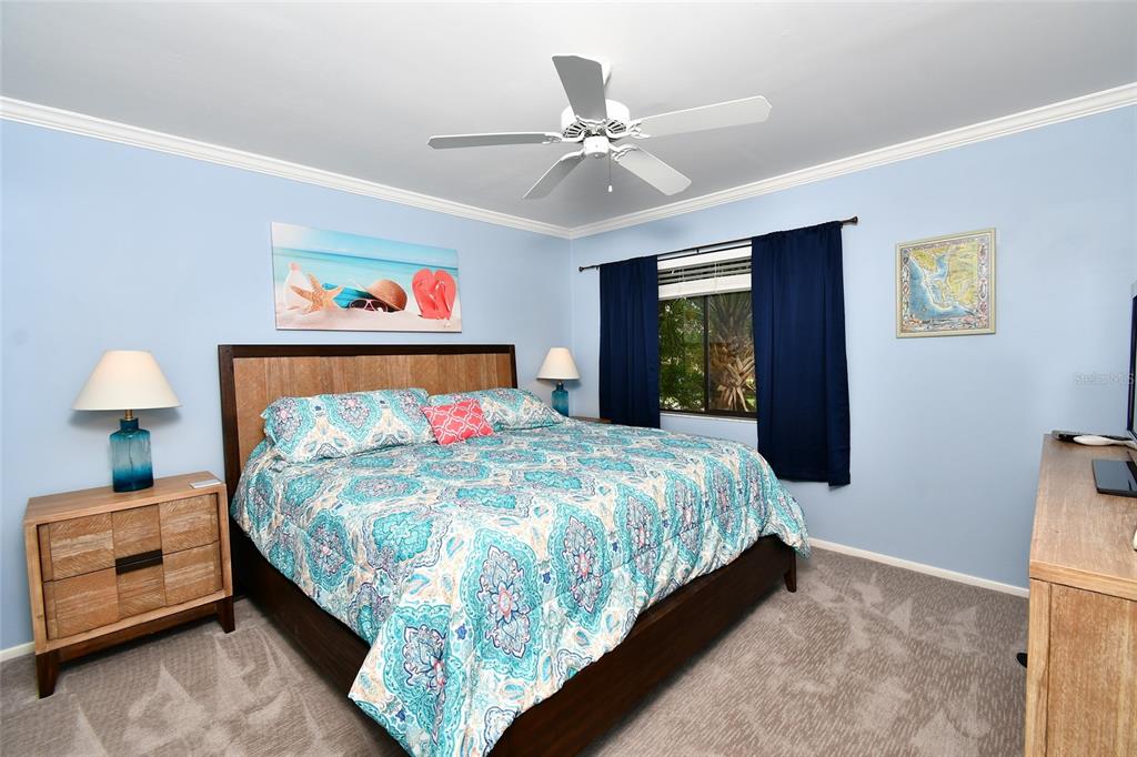 1590 Islamorada Boulevard, Unit 84C Punta Gorda, FL 33955 - Photo 30 of 38 a bedroom with a bed and window