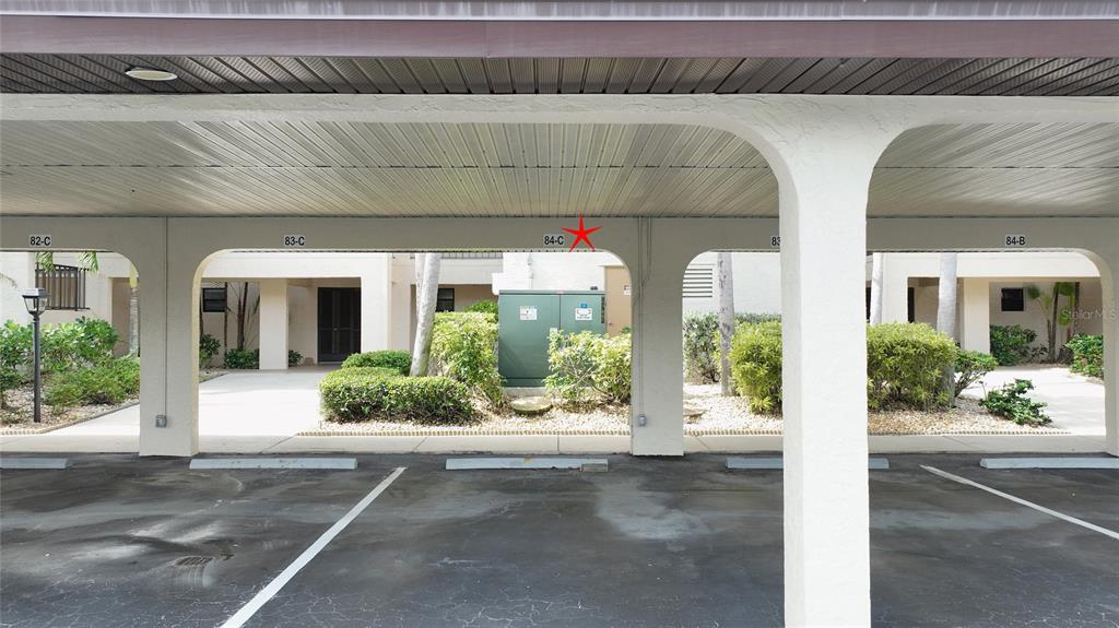 1590 Islamorada Boulevard, Unit 84C Punta Gorda, FL 33955 - Photo 37 of 38 a view of a building with a window and potted plants