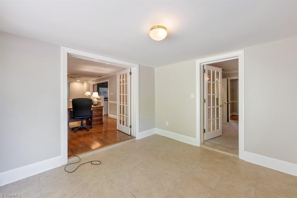 800 Archer Road Winston-Salem, NC 27106 - Photo 16 of 32 Sunroom accessed from the den and primary bedroom.