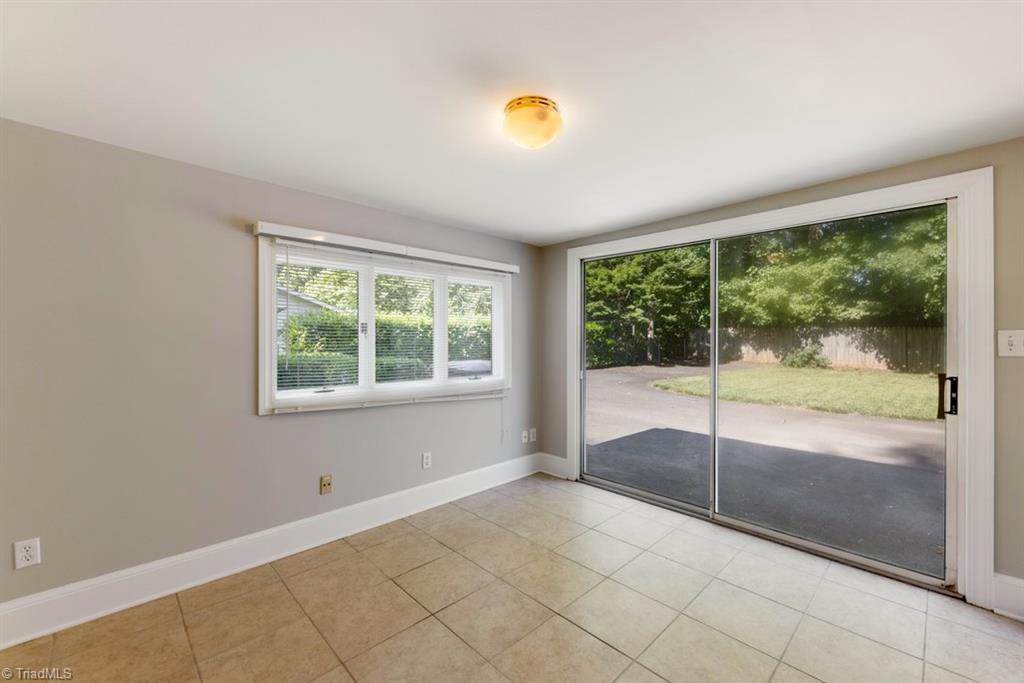 800 Archer Road Winston-Salem, NC 27106 - Photo 17 of 32 Sliding glass door in the sunroom opens to the back yard.