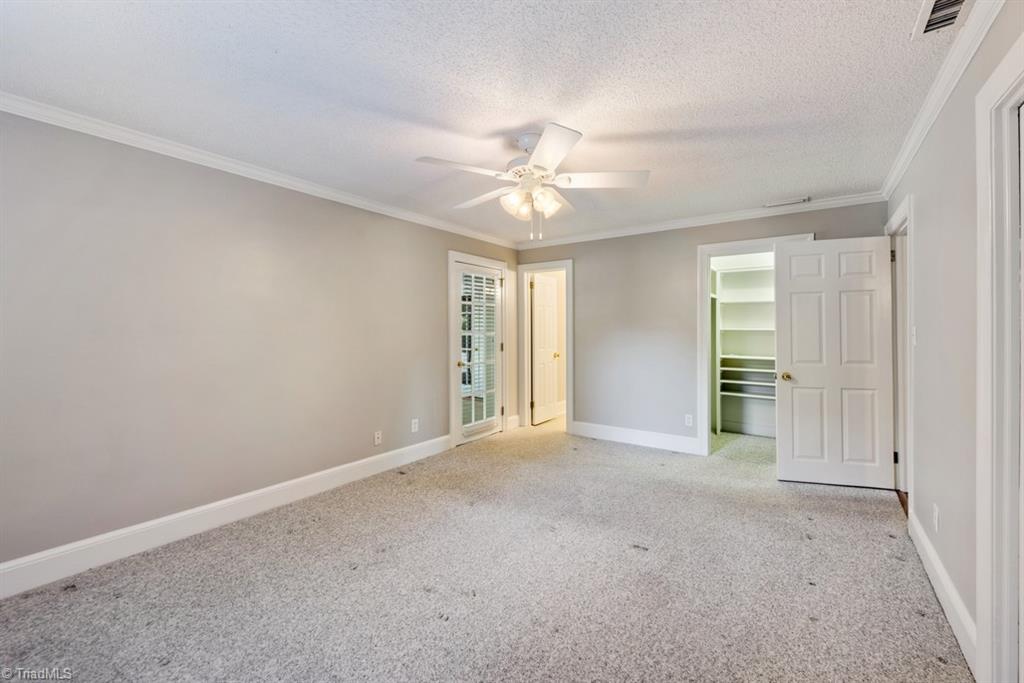 800 Archer Road Winston-Salem, NC 27106 - Photo 18 of 32 Primary bedroom with walk-in closet.