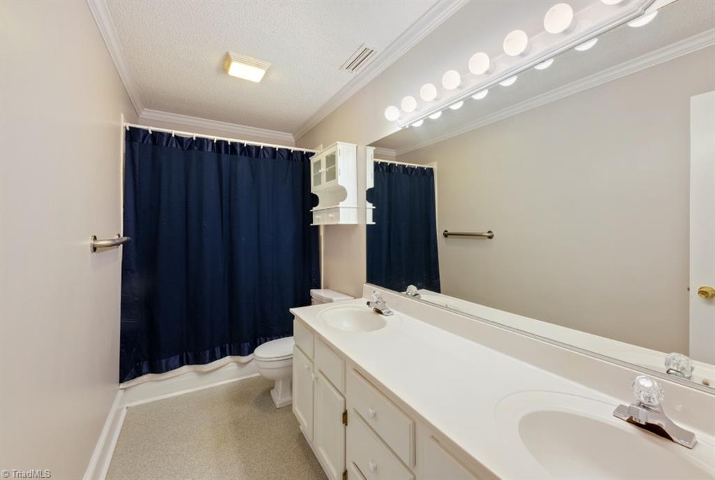 800 Archer Road Winston-Salem, NC 27106 - Photo 20 of 32 Primary bathroom with double vanity.