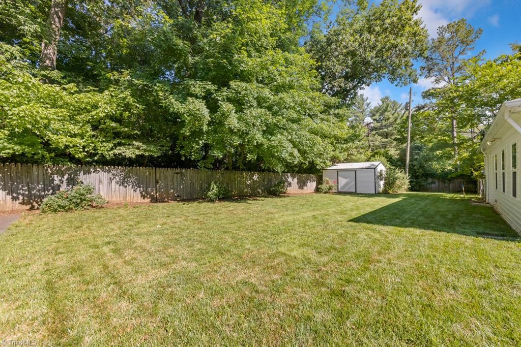 800 Archer Road Winston-Salem, NC 27106 - Photo 29 of 32 Nice back yard is completely fenced with a gate across the driveway.