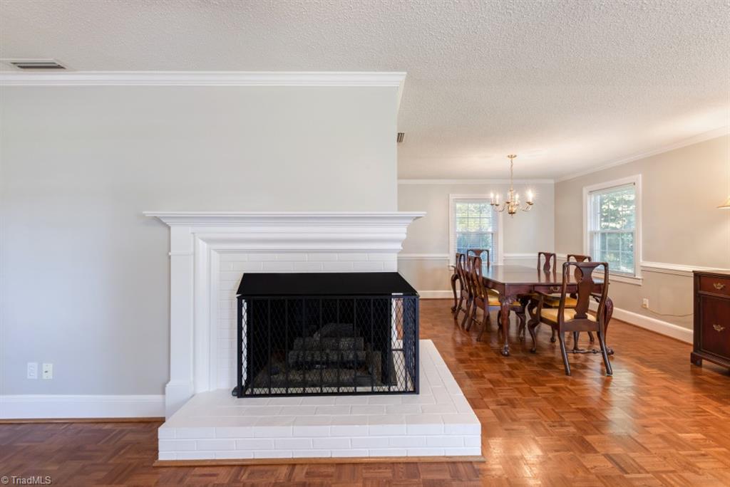 800 Archer Road Winston-Salem, NC 27106 - Photo 7 of 32 Corner fireplace fronts great room and dining room.