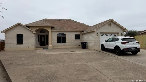 a view of a car parked in front of a house