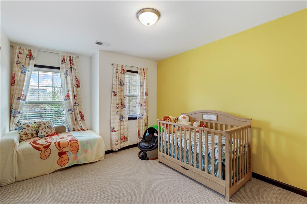 4430 Cedar Bridge Walk Suwanee, GA 30024 - Photo 24 of 29 a view of a bedroom with windows