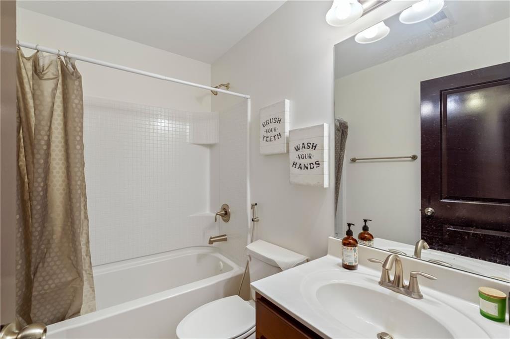 4430 Cedar Bridge Walk Suwanee, GA 30024 - Photo 25 of 29 a bathroom with a sink toilet and shower