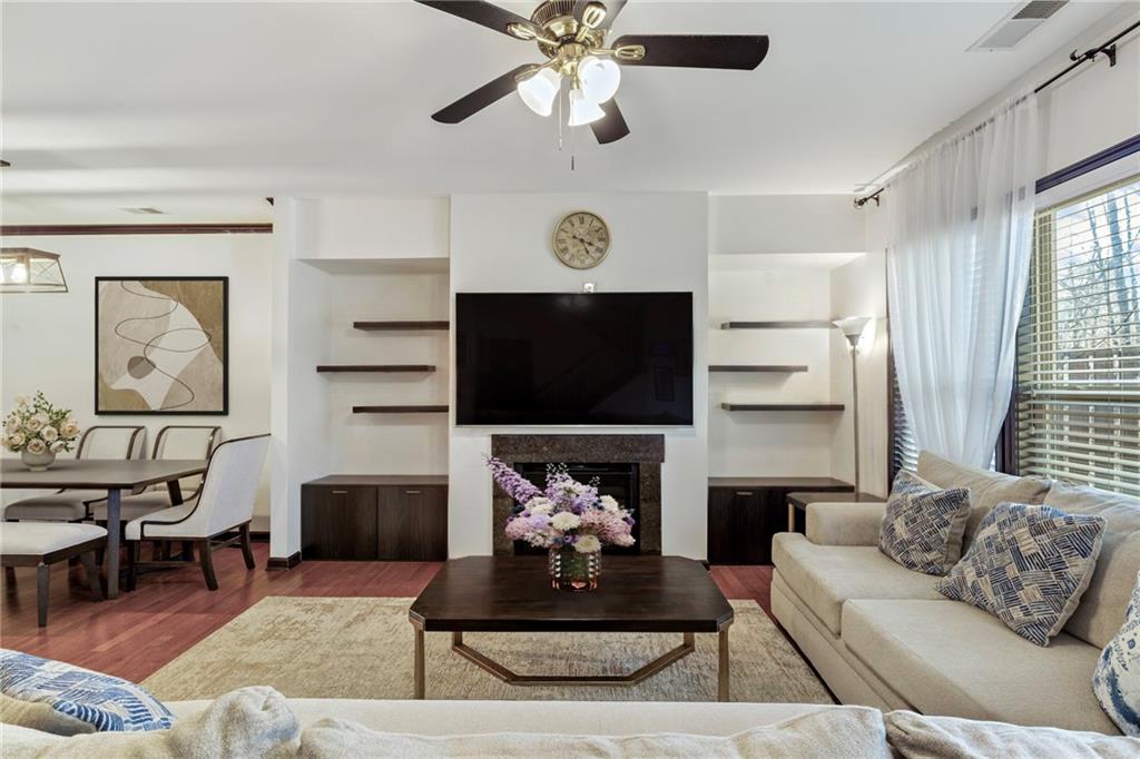 4430 Cedar Bridge Walk Suwanee, GA 30024 - Photo 5 of 29 a living room with furniture a rug and a flat screen tv