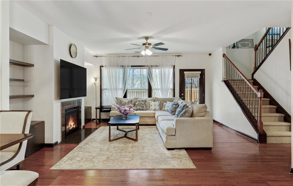4430 Cedar Bridge Walk Suwanee, GA 30024 - Photo 7 of 29 a living room with fireplace furniture and a flat screen tv