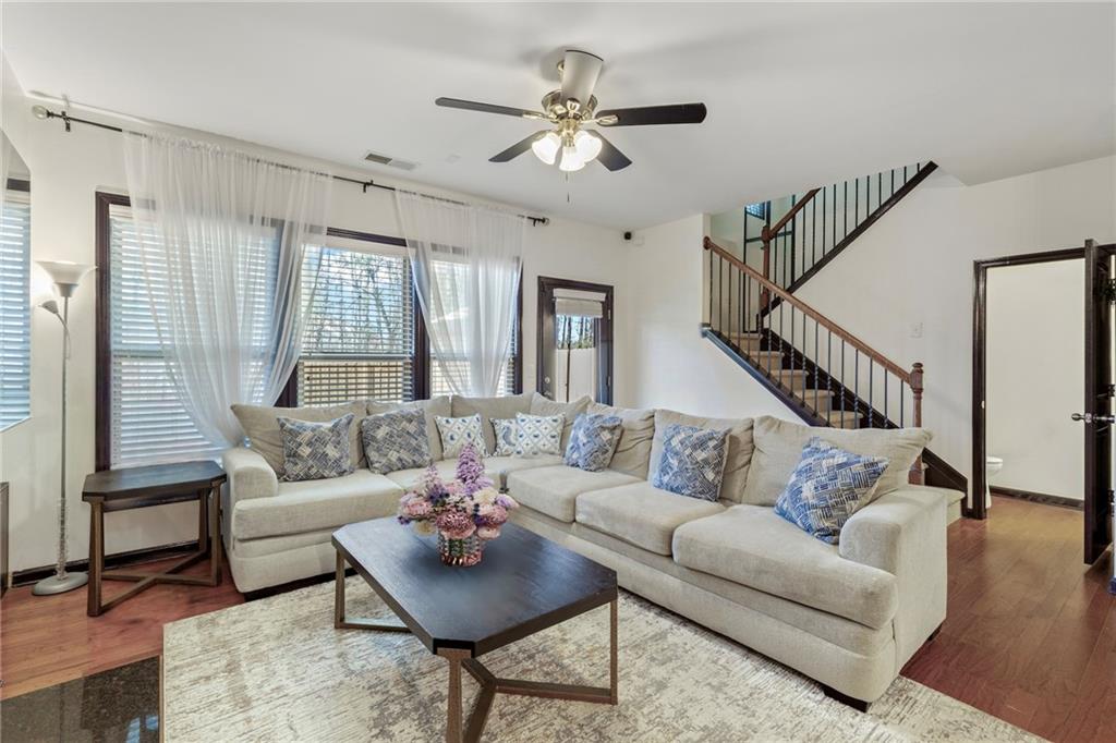 4430 Cedar Bridge Walk Suwanee, GA 30024 - Photo 9 of 29 a living room with furniture and a large window
