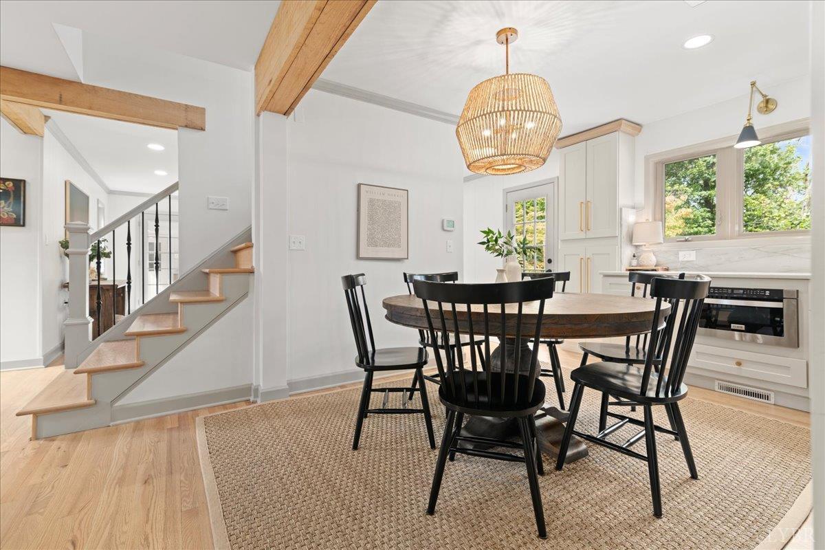 181 Mobley Mountain Road Amherst, VA 24521 - Photo 19 of 98 a view of a dining room with furniture window and wooden floor