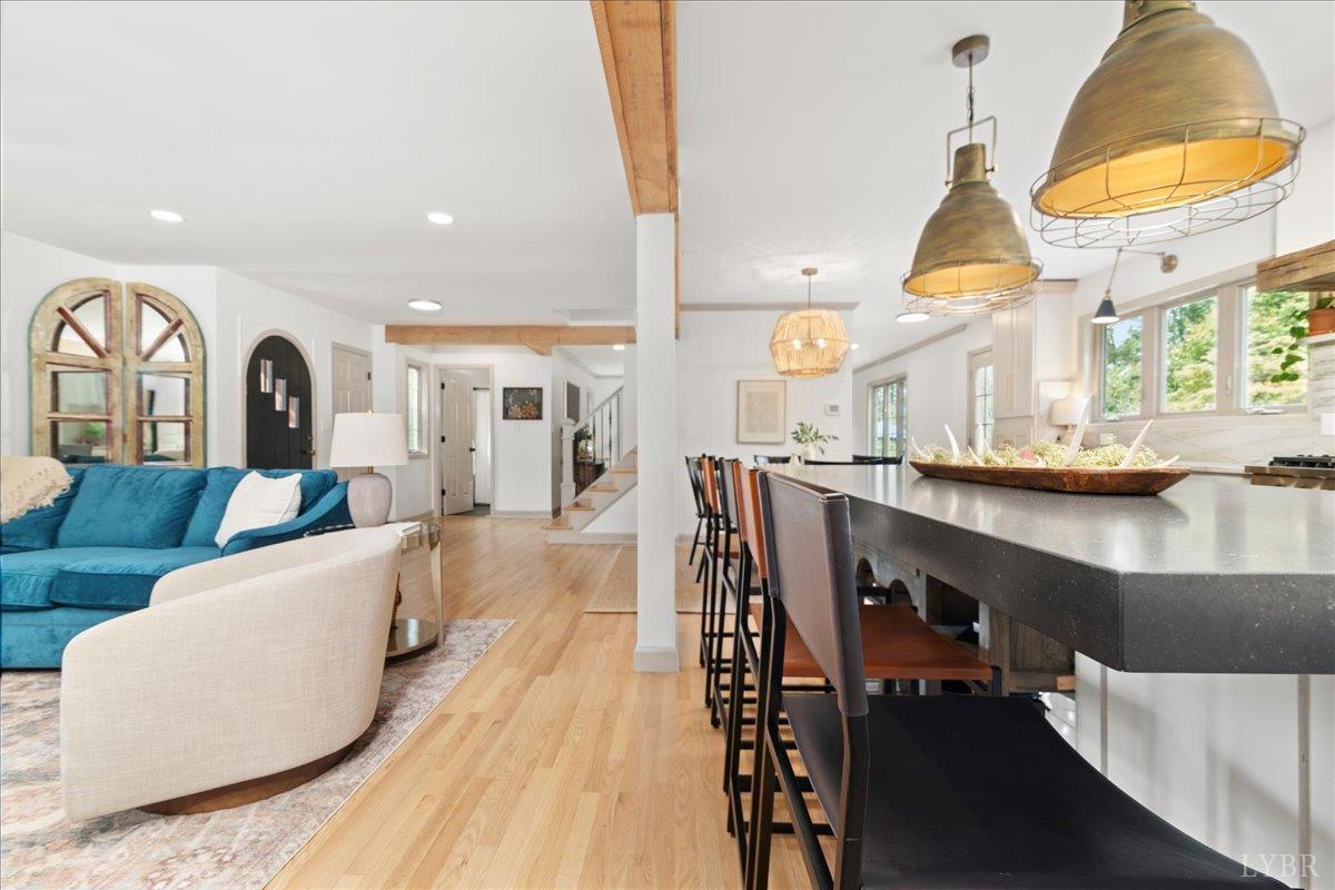 181 Mobley Mountain Road Amherst, VA 24521 - Photo 20 of 98 a living room with a couch and a chandelier