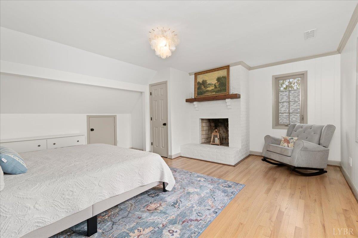 181 Mobley Mountain Road Amherst, VA 24521 - Photo 44 of 98 a spacious bedroom with a bed and a couch