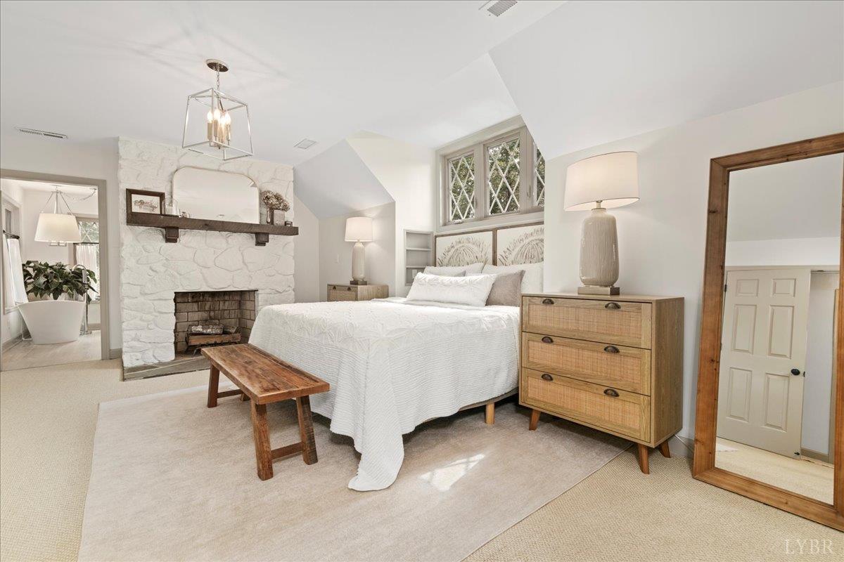 181 Mobley Mountain Road Amherst, VA 24521 - Photo 53 of 98 a bedroom with a bed and a mirror on the dresser