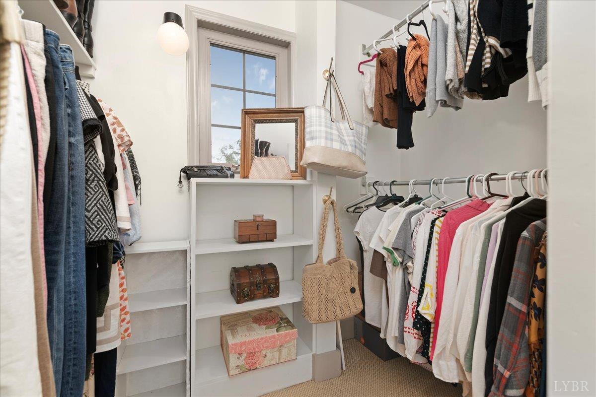 181 Mobley Mountain Road Amherst, VA 24521 - Photo 55 of 98 a view of walk in closet with clothes and shoes