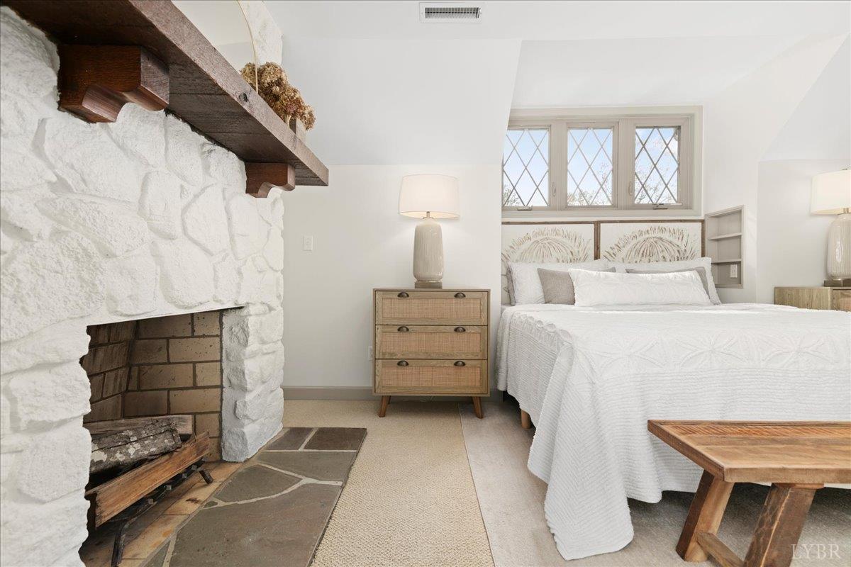 181 Mobley Mountain Road Amherst, VA 24521 - Photo 56 of 98 a bedroom with a bed and a chair