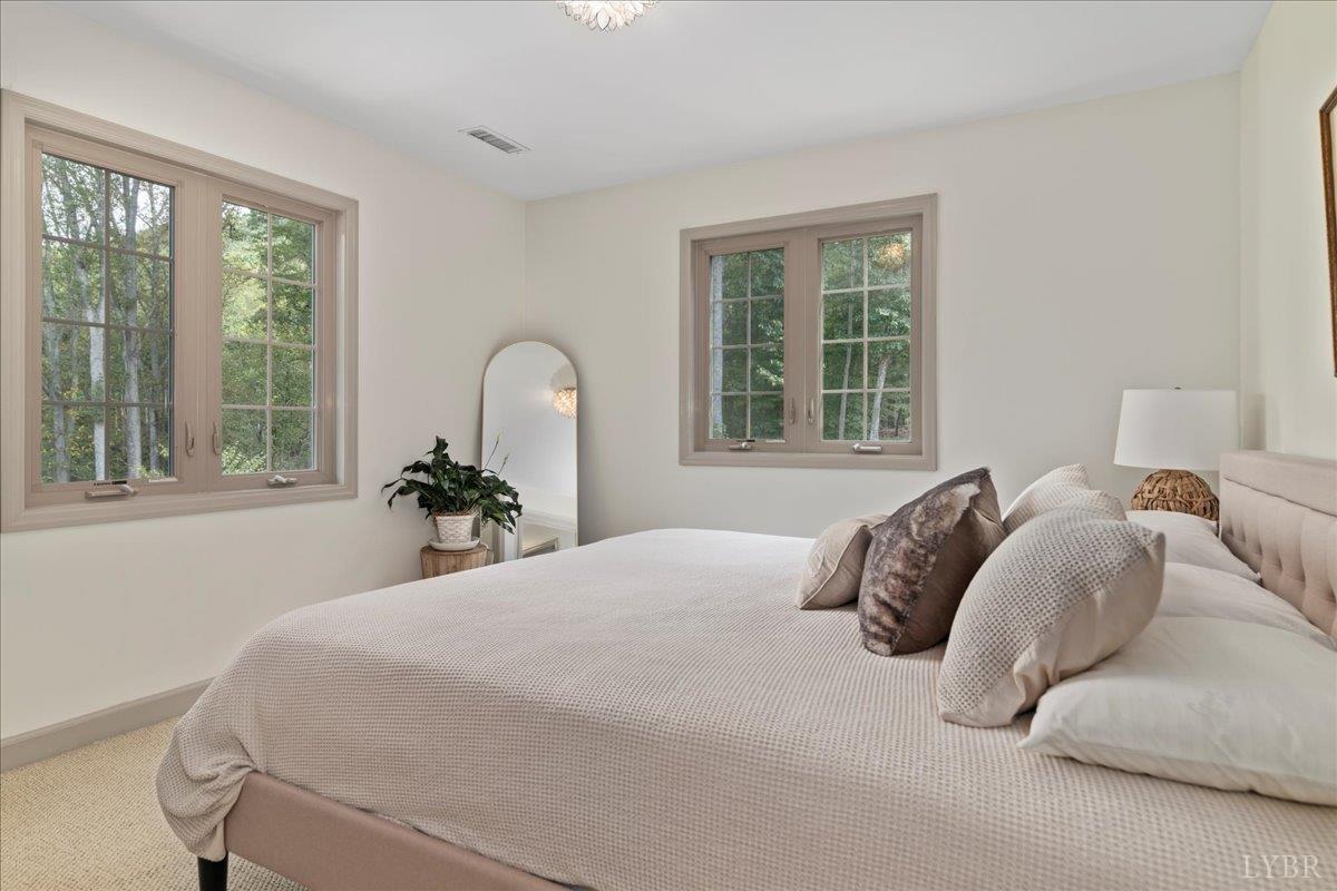 181 Mobley Mountain Road Amherst, VA 24521 - Photo 67 of 98 a bedroom with a bed and a large window