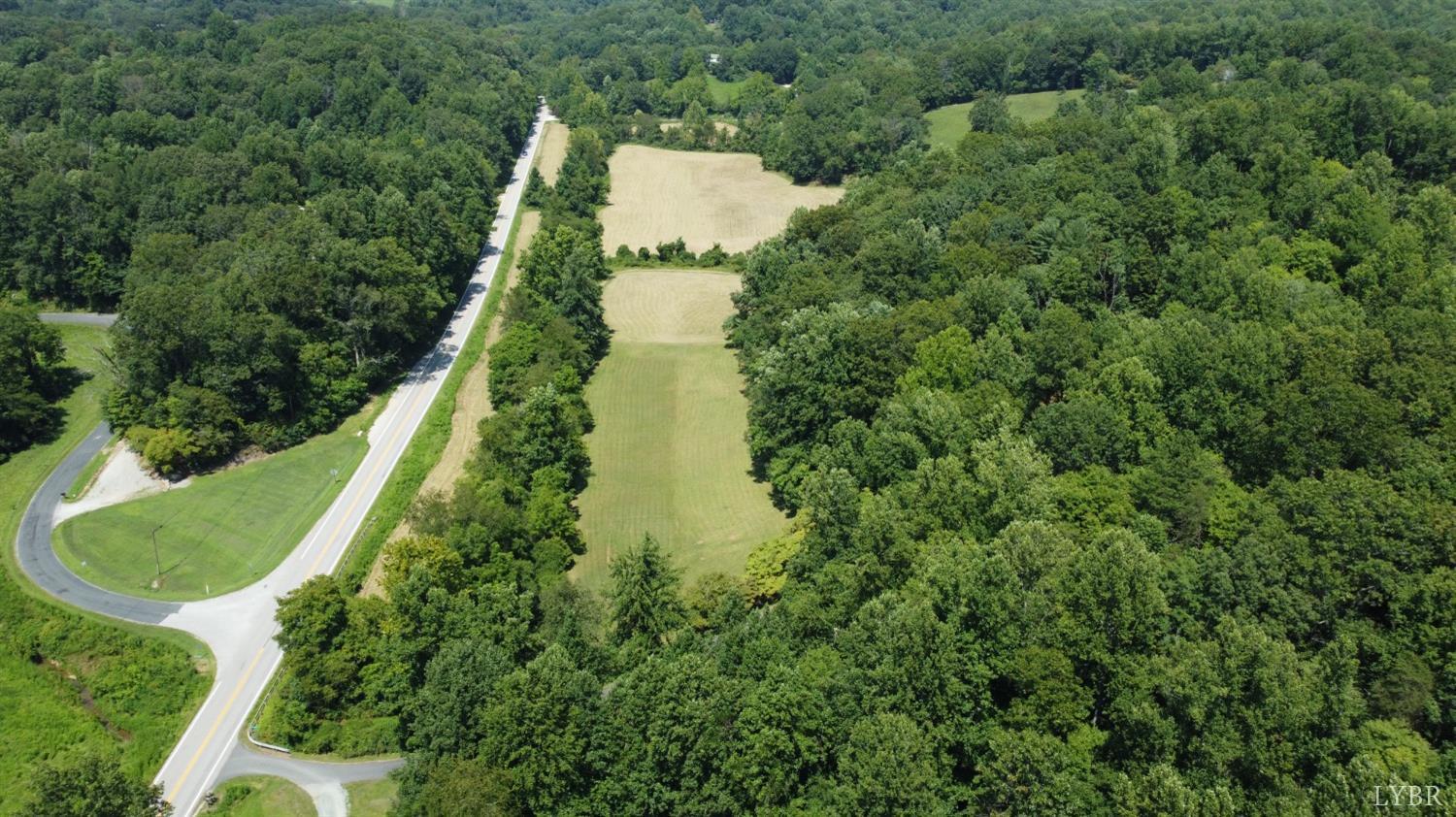 181 Mobley Mountain Road Amherst, VA 24521 - Photo 90 of 98 an aerial view of residential house with outdoor space and trees all around