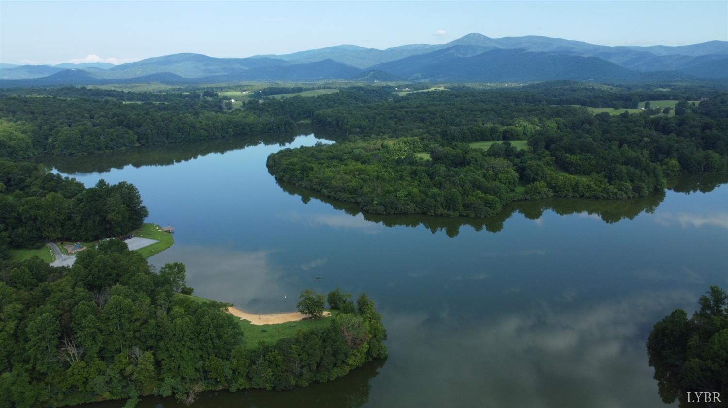 181 Mobley Mountain Road Amherst, VA 24521 - Photo 96 of 98 a view of a lake with a mountain in the background