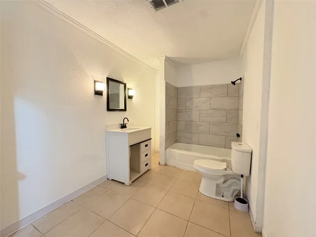 a bathroom with a bathtub and shower