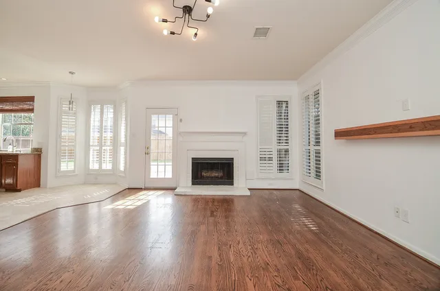 a view of a kitchen with granite countertop a sink and dishwasher next to a window