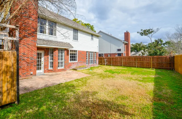 a view of road with large trees