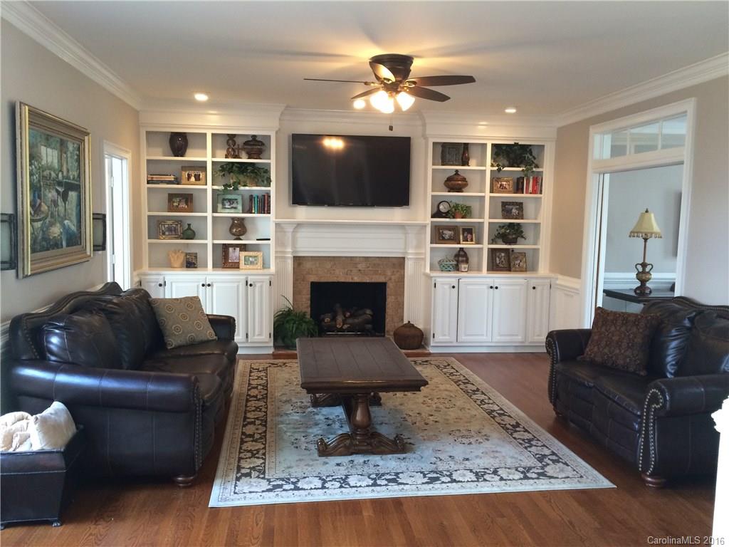 4732 Binfords Ridge Road Charlotte, NC 28226 - Photo 3 of 13 a living room with furniture and a fireplace