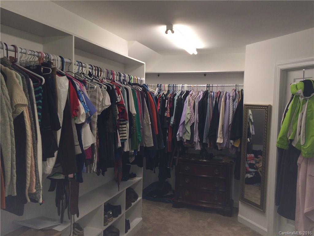 4732 Binfords Ridge Road Charlotte, NC 28226 - Photo 6 of 13 a view of walk in closet with clothes and shoes