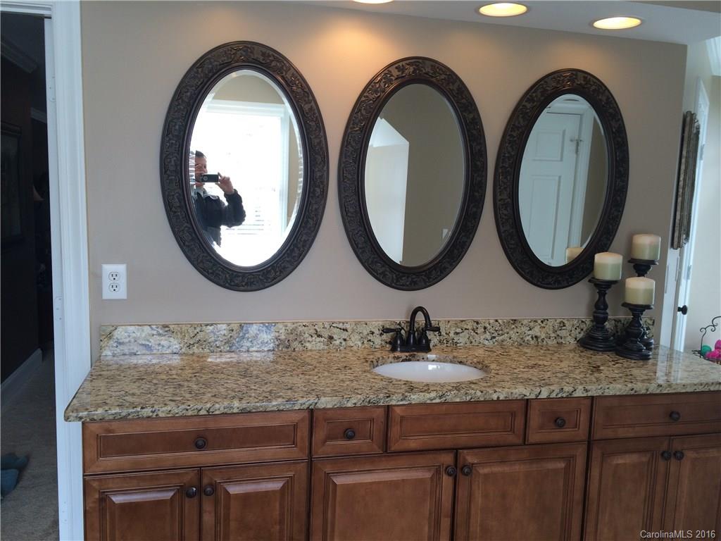 4732 Binfords Ridge Road Charlotte, NC 28226 - Photo 7 of 13 a bathroom with a granite countertop double vanity and a mirror
