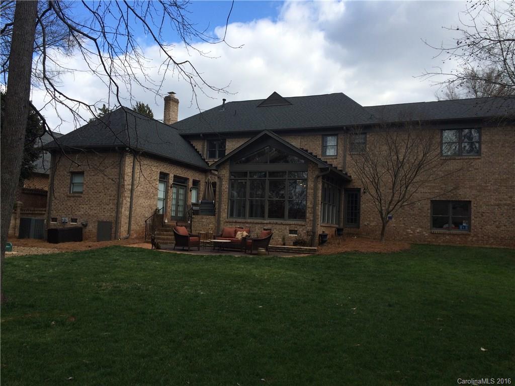 4732 Binfords Ridge Road Charlotte, NC 28226 - Photo 10 of 13 a front view of a house with a garden and trees
