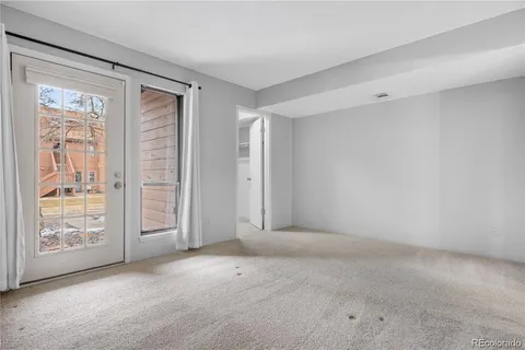 a view of an empty room with windows